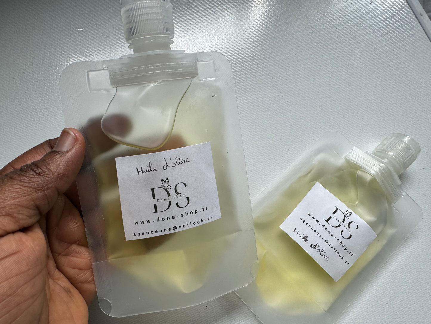 Huile d’olive (cheveux, corps et visage )