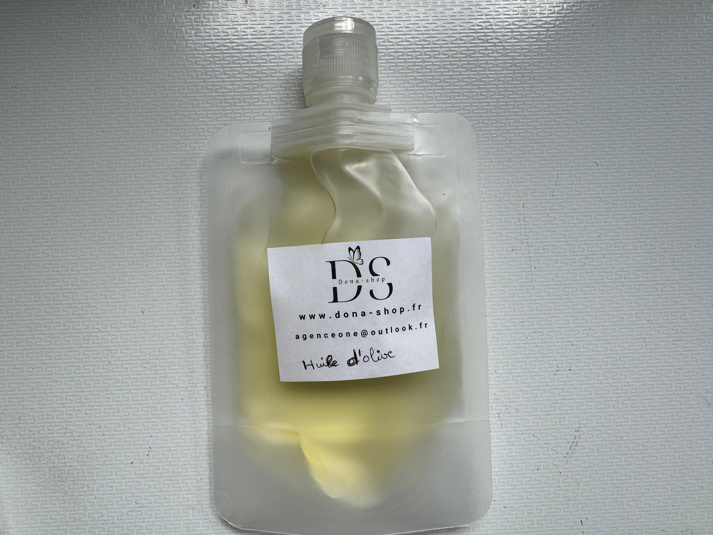 Huile d’olive (cheveux, corps et visage )